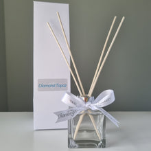 Load image into Gallery viewer, Clear square glass diffuser with natural reeds and white box
