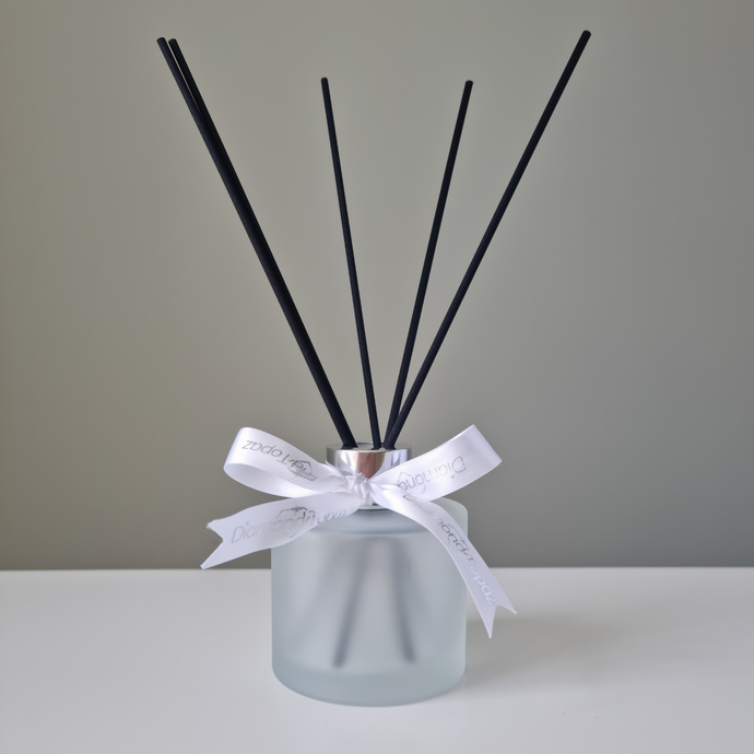 Frosted glass diffuser, with black reeds and white & silver ribbon
